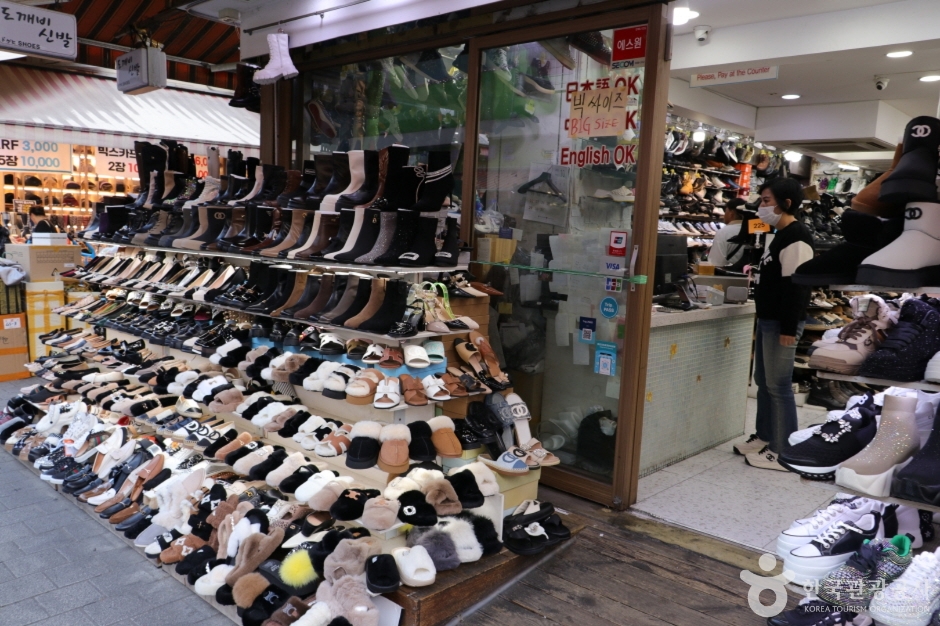 A shop front stacked from floor to ceiling with trainers at Namdaemun Market